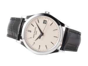 Calatrava Stainless Steel watch with ivory dial (38mm) and black leather strap displayed at an angle on a white background.