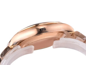 Side view of a Cosmograph Daytona Rose Gold watch with a chocolate dial, highlighting the sleek rose gold case and details.