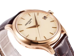 Calatrava Rose Gold with Ivory Dial (39mm) watch featuring a sleek brown leather strap and elegant date window.
