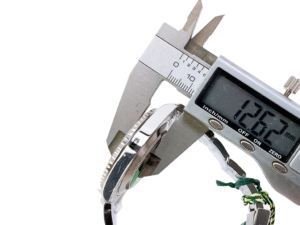 Caliper measuring the thickness of Submariner Date Stainless Steel 'Cookie Monster' (41mm) watch. Measurement reads 12.62mm.