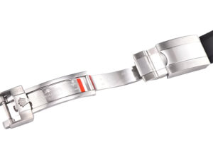Close-up view of the stainless steel clasp and black Oysterflex strap on the Cosmograph Daytona watch.