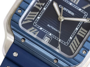 Close-up of Santos Large Stainless Steel watch with blue dial, blue bezel, rubber strap, Roman numerals, date display (40mm).