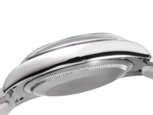 Side view of the Oyster Perpetual 36 Stainless Steel watch case, showcasing a polished finish and smooth bezel design.