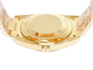 Back view of the Day-Date 40 Yellow Gold ‘President’ watch showing the solid case back and fluted edges on a gold bracelet.