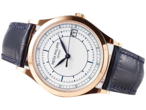 Calatrava Rose Gold ‘Scientific’ watch with silver dial, 38mm case, and dark leather strap displayed at an angled view.