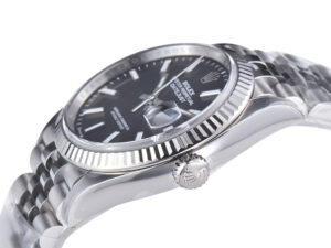 Datejust 36 Stainless Steel on Jubilee, black dial with fluted bezel, showcasing sleek craftsmanship and timeless design.