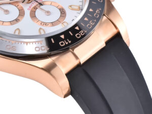 Close-up of Cosmograph Daytona Rose Gold Oysterflex watch with ivory dial, black Cerachrom bezel, and black rubber strap.