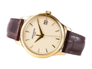 Calatrava Yellow Gold watch with an ivory dial, 39mm case, brown leather strap, and a date display at the 3 o'clock position.