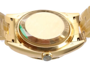 Back view of the Day-Date 36 Yellow Gold 'President' watch, showcasing its gold case and crown with a smooth design.