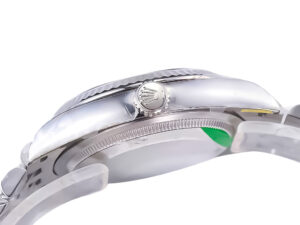 Side view of the Datejust 36 Stainless Steel on Jubilee, showcasing the fluted bezel and crown with a mint green dial accent.