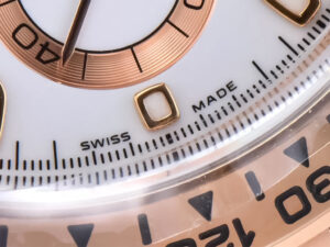 Close-up of the Cosmograph Daytona Rose Gold with Ivory Dial, showcasing the "Swiss Made" text and detailed hour markers.