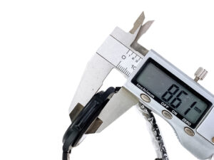Digital caliper measuring the thickness of the Nautilus ‘Black Venom’ Limited Edition Carbon Steel watch at 8.61mm.