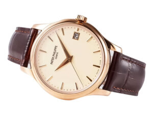 Calatrava Rose Gold watch with ivory dial, 39mm case, brown leather strap, and date display at 3 o’clock position.