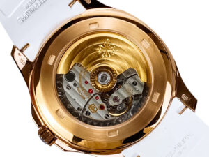Back view of the Aquanaut Rose Gold with Chocolate Dial and White Strap (40mm), showcasing its intricate mechanical movement.