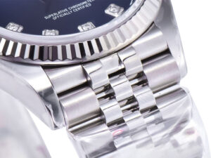 Close-up of the Datejust 36 Stainless Steel on Jubilee bracelet, featuring a fluted bezel and diamond-accented blue dial.