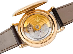 Back view of the Calatrava Yellow Gold watch (38mm) showcasing its open caseback with visible mechanical movement.
