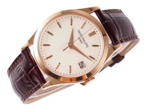 Calatrava Rose Gold watch with 38mm ivory dial and brown leather strap, featuring date display at 3 o’clock.