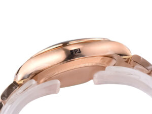 Side view of Cosmograph Daytona Rose Gold with Chocolate Dial, showing rose gold case and transparent protective wrap.