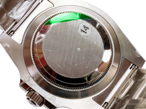 Back view of Submariner Date Stainless Steel with Black Dial (40mm), showcasing the watch's polished case back and bracelet.