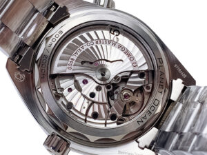 Rear view of the Seamaster Planet Ocean 600 displaying its intricate automatic movement through a transparent case back.