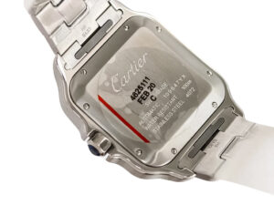 Back view of Santos Large Stainless Steel watch with engraved details on the stainless steel case and visible blue crown.