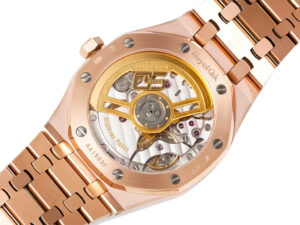Rear view of the Royal Oak Pink Gold '50th Anniversary' watch showcasing its intricate black dial and exposed mechanism.