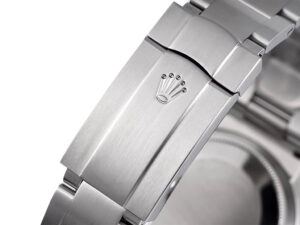 Close-up of the clasp on the Oyster Perpetual 36 Stainless Steel watch, engraved with logo; partial view of the case back.