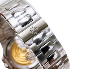 Close-up of the Nautilus Stainless Steel bracelet with engraved logo, showcasing part of the blue dial and exposed back case.