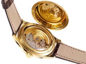 Back view of the Calatrava Yellow Gold (39mm) watch showing its open case back with visible intricate mechanical movement.