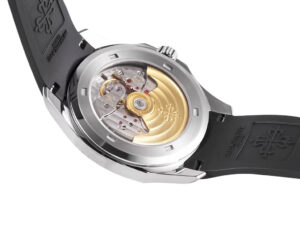 Back view of the Aquanaut Stainless Steel (38mm) showing its mechanical movement, gold rotor, and black rubber strap.