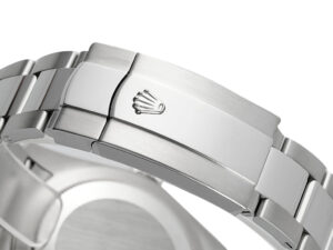 Close-up of the clasp on the Sky-Dweller Stainless Steel Oyster bracelet, showcasing brushed finish and signature crown logo.