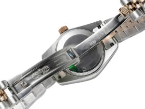 Lady-Datejust 28 Two Tone Rose Gold on Jubilee, showcasing the clasp and caseback details with green accents.