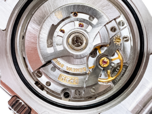 Close-up view of the movement mechanism inside the Submariner Date Stainless Steel with Black Dial (41mm) watch.