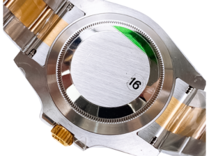 Close-up of the case back of the Submariner Date Stainless Steel ‘Cookie Monster’ (41mm) with green sticker "16" marking.