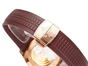 Close-up of the rose gold clasp and chocolate brown strap of the Aquanaut Rose Gold with Chocolate Dial (40mm) watch.