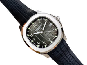 Aquanaut Stainless Steel with Black Dial (40mm) watch featuring a grid-patterned face, black rubber strap, and date display.