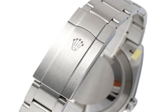 Close-up of the stainless steel bracelet clasp with etched logo, part of the Oyster Perpetual 41 Yellow Dial watch.