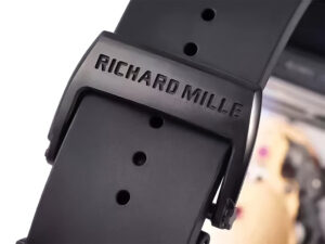 Close-up of the Richard Mille logo engraved on the black buckle of the RM 52-01 Skull Tourbillon’s black rubber strap.