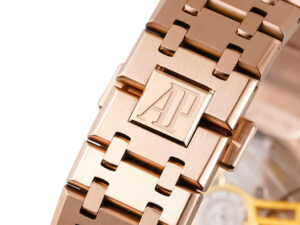 Close-up of the Royal Oak Pink Gold ’50th Anniversary’ watch with AP logo detail, showcasing its luxurious craftsmanship.