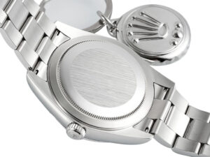 Back view of the Sky-Dweller Stainless Steel on Oyster with brushed finish, showing the case back and tag.