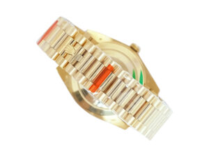 Day-Date 40 Yellow Gold ‘President’ watch with fluted bezel, white Roman numeral dial, and gold bracelet in protective wrap.