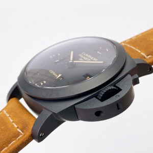 Luminor 1950 3 Days GMT Automatic Ceramica watch with black dial & brown leather strap, side view highlighting case details.