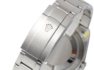 Stainless steel clasp with engraved crown logo, part of the Oyster Perpetual 41 watch with a red dial.