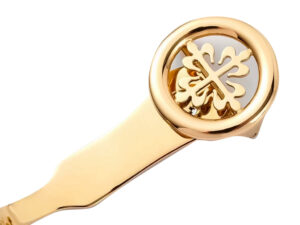 Close-up of the gold buckle featuring logo, part of the Calatrava Yellow Gold with Silver Guilloché Dial (38mm).