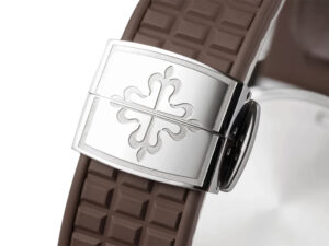 Close-up of the Aquanaut Luce Stainless Steel Diamond Brown Clasp featuring stainless steel design on a textured brown strap.