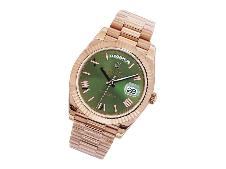 Day-Date 40 Rose Gold 'President' watch with olive green dial, Roman numerals, fluted bezel, and day-date display.