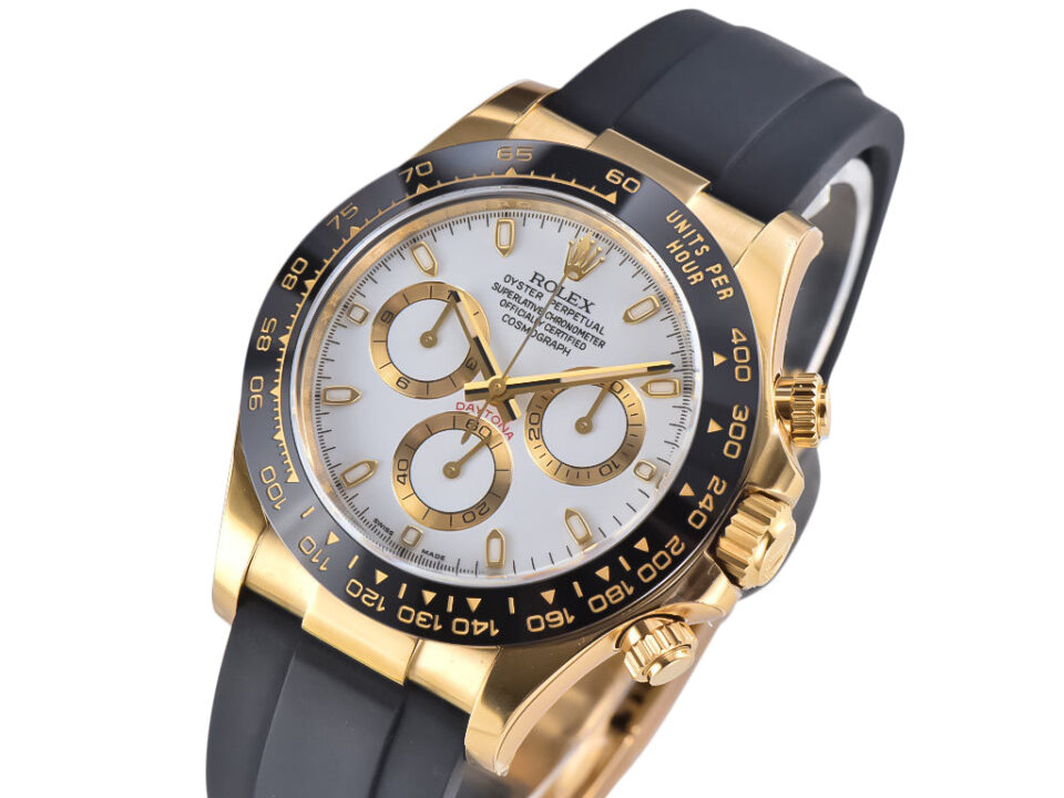 Cosmograph Daytona in yellow gold with white dial, black ceramic bezel, and Oysterflex strap displayed at an angle.