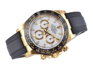 Cosmograph Daytona in yellow gold with white dial and black Oysterflex strap, featuring three sub-dials and tachymeter bezel.