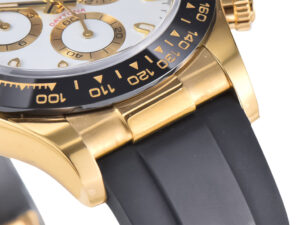 Close-up of Cosmograph Daytona in yellow gold with white dial, black bezel, and Oysterflex strap showcasing elegant details.