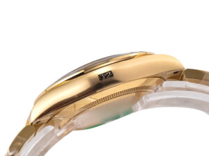 Side view of the Cosmograph Daytona Yellow Gold with Champagne Dial, showcasing its polished gold case and sleek design.